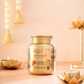 Bharat Vedica A2 Gir Cow Ghee in Stainless Steel Jar on a decorative background with candles and lights