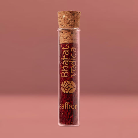 A glass jar filled with the aromatic spice, Bharat Vedica Kashmir Saffron/ Kashmir Kesar.