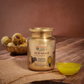 Bharat Vedica A2 Gir Cow Ghee in Stainless Steel Jar on a wooden table