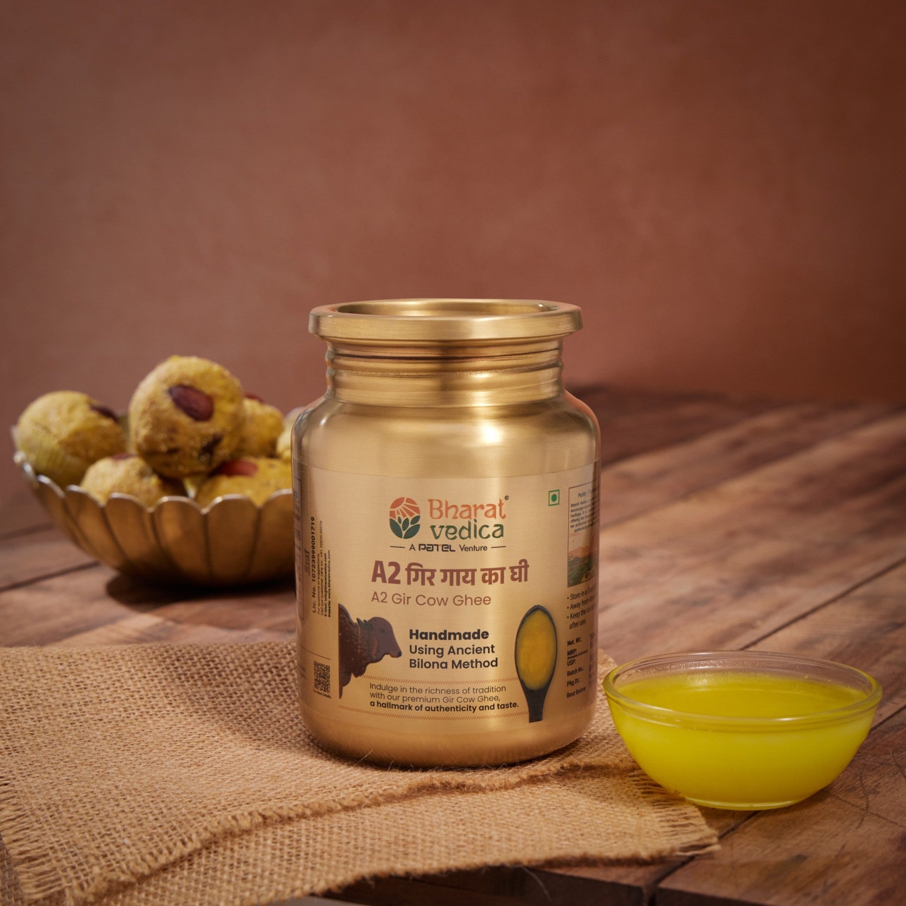 Bharat Vedica A2 Gir Cow Ghee in Stainless Steel Jar on a wooden table