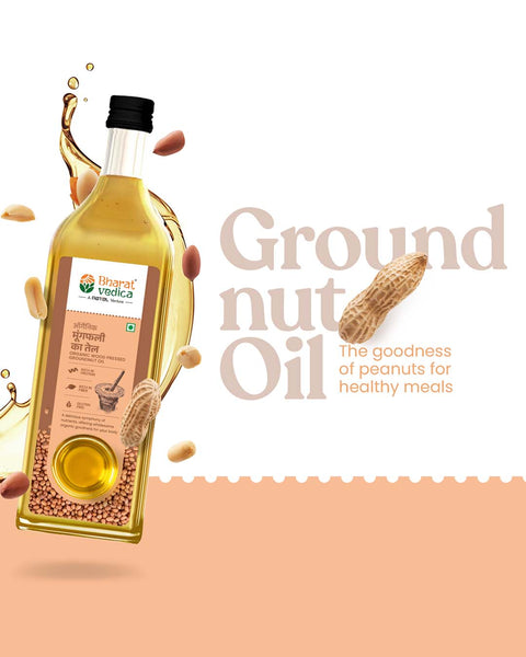 Bottle of Bharat Vedica Organic Wood Pressed Groundnut Oil with peanuts and oil splashes on a beige background