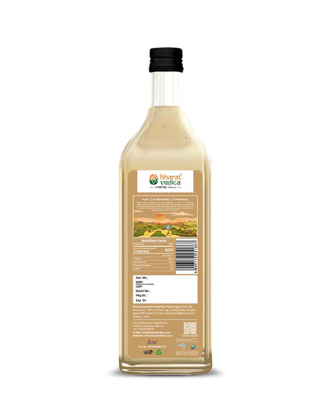 Bottle of Bharat Vedica Organic Wood Pressed White Sesame Oil with packaging label on a white background