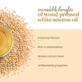Bharat Vedica Organic Wood Pressed White Sesame Oil and seeds with benefits listed on a beige background