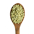 organic green peas in spoon
