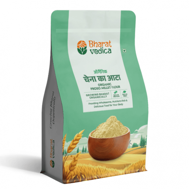 A green and white packet of Bharat Vedica brand Organic Proso Millet Flour, with text in both Hindi and English. The packet features the brand logo at the top and an image of proso millet grains at the bottom. The text on the packet reads "ऑर्गेनिक चेना का आटा ORGANIC PROSO MILLET FLOUR" and "Providing Wholesome, Nutrient-Rich & Delicious Food for Your Body".