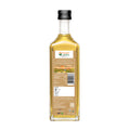 Bottle of Bharat Vedica Organic Wood Pressed White Sesame Oil with packaging label on a white background